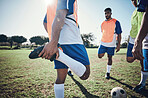 Football player, stretching legs and men training on a field for sports game and fitness. Male soccer team or athlete group outdoor for challenge, workout or warm up exercise on a grass pitch