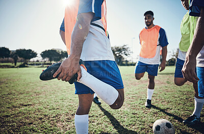 Buy stock photo Football player, stretching legs and men training on a field for sports game and fitness. Male soccer team or athlete group outdoor for challenge, workout or warm up exercise on a grass pitch