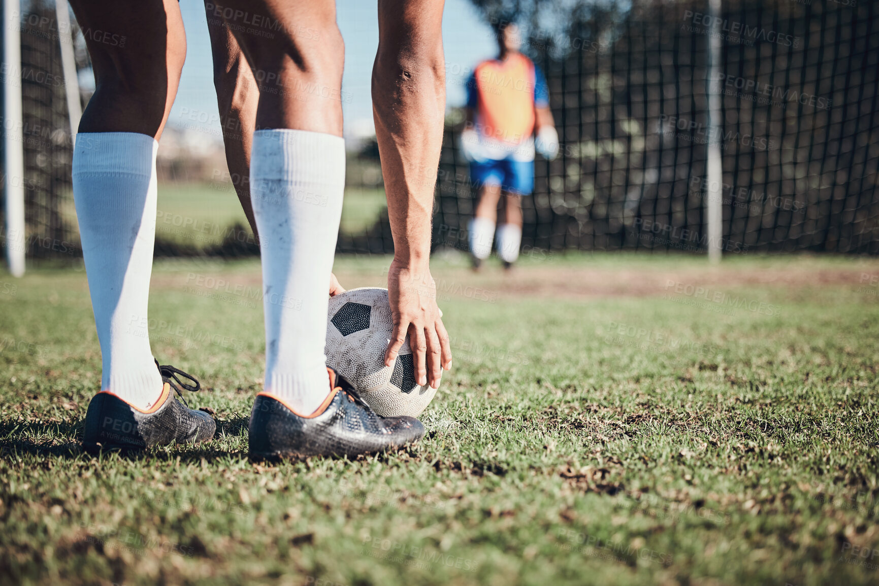 Buy stock photo Soccer ball, sports and feet of person to kick on field, fitness training or shoot for a goal in the net. Football, player and legs of athlete in exercise, competition or sport challenge for goals