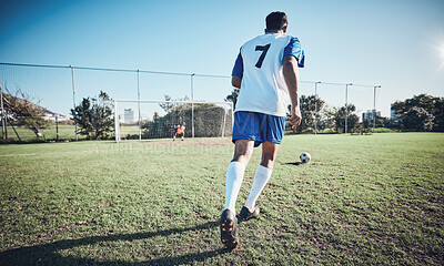 Buy stock photo Sports, penalty and soccer player score a goal at training, game or match at a tournament. Fitness, exercise and back of a male football athlete kicking a ball at practice on outdoor field at stadium