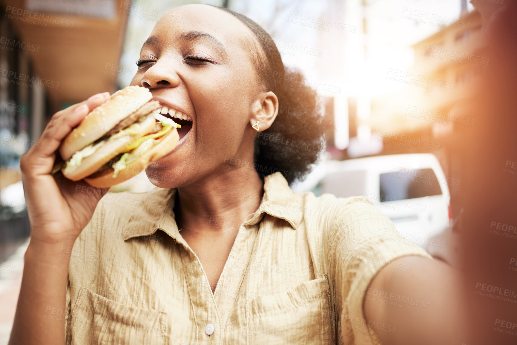 Buy stock photo Burger, eating and black woman in selfie, city and restaurant for outdoor promotion, social media and live streaming review. Fast food, hungry customer, person or influencer with lunch or photography