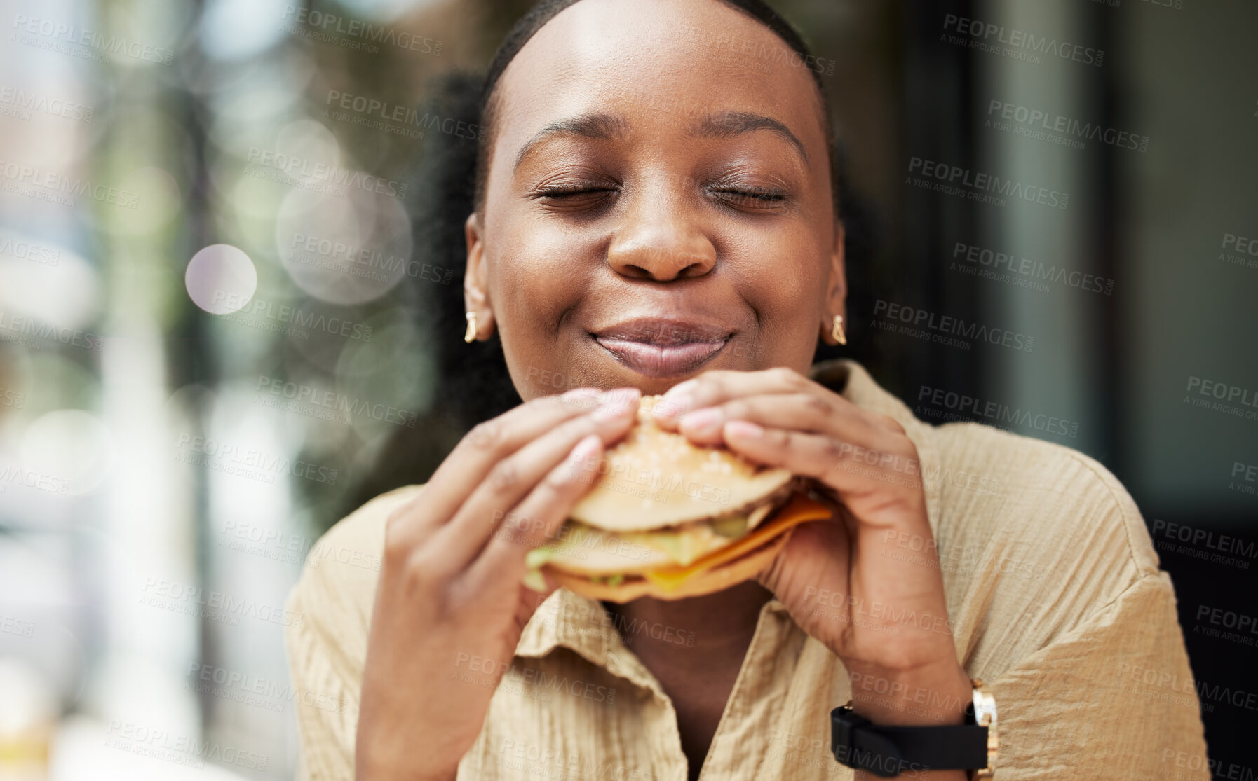 Buy stock photo Restaurant, fast food and black woman eating a burger in an outdoor cafe as a lunch meal craving deal. Breakfast, sandwich and young female person or customer enjoying a tasty unhealthy snack