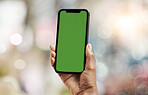 Smartphone, green screen and person hands in city for social media, advertising and website ui or ux design mockup. Mobile app, technology and people with phone space for outdoor or urban bokeh