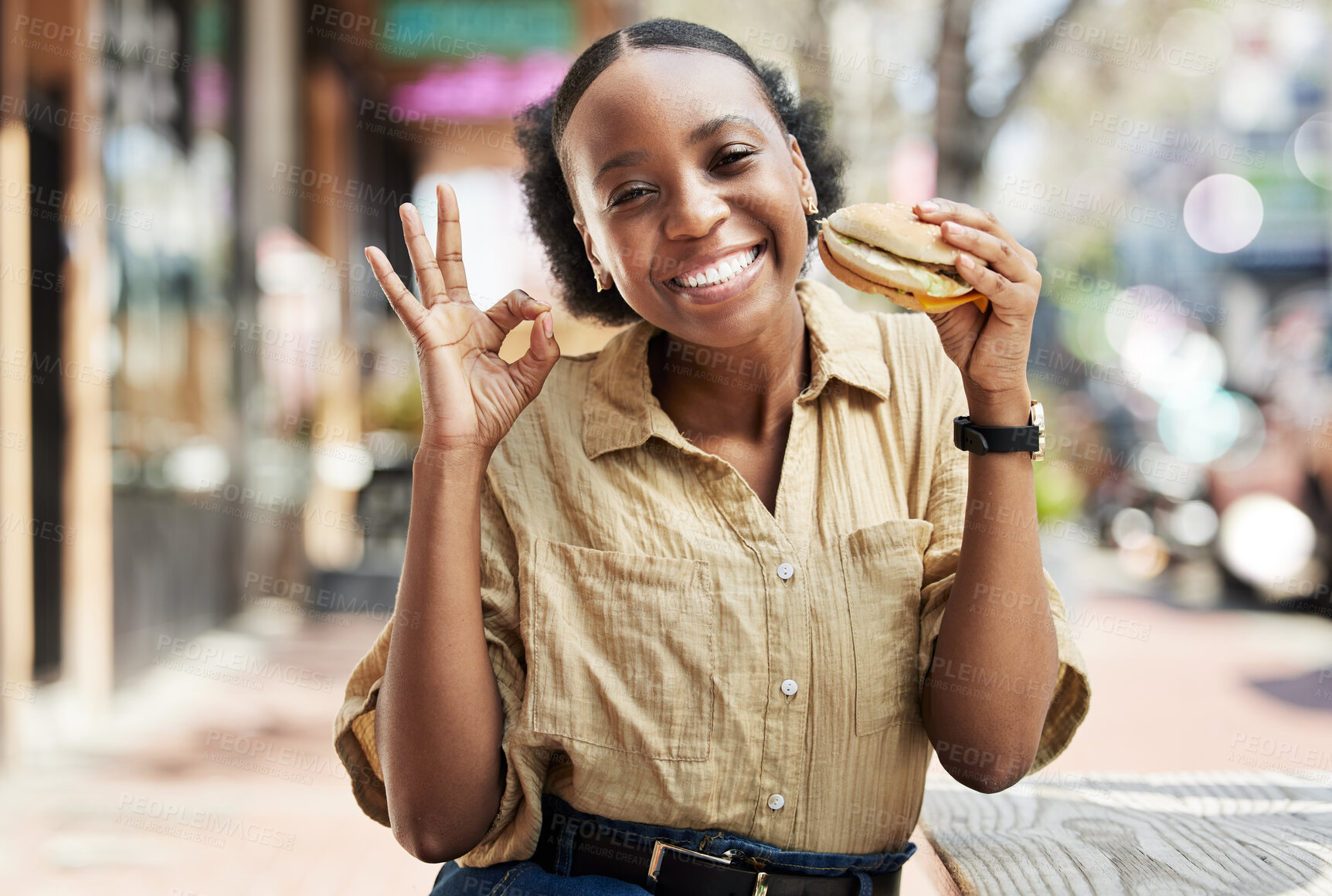 Buy stock photo Burger, okay sign and portrait of woman in city, outdoor restaurant and happy customer experience or services. Fast food, like and excited african person with lunch review, excellence and yes emoji