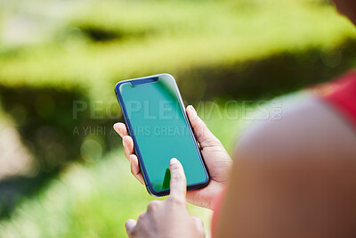 Buy stock photo Woman, hands and phone mockup for advertising, mobile app or communication on green screen in nature. Female person with smartphone display or chromakey for advertisement or marketing in the outdoors