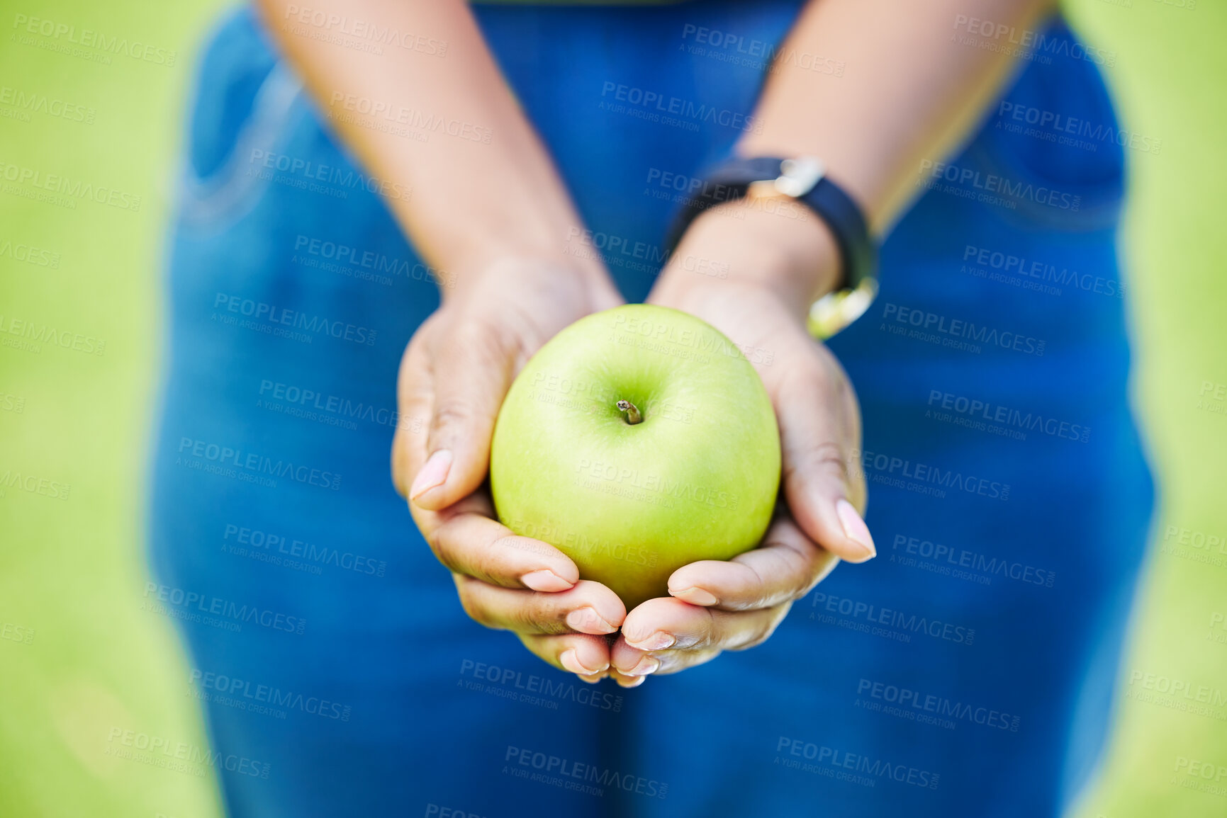 Buy stock photo Woman, hands and apple for natural nutrition, diet or food in health and wellness in nature outdoors. Closeup of person holding green organic fruit in palm for sustainability, vitamin or fiber meal