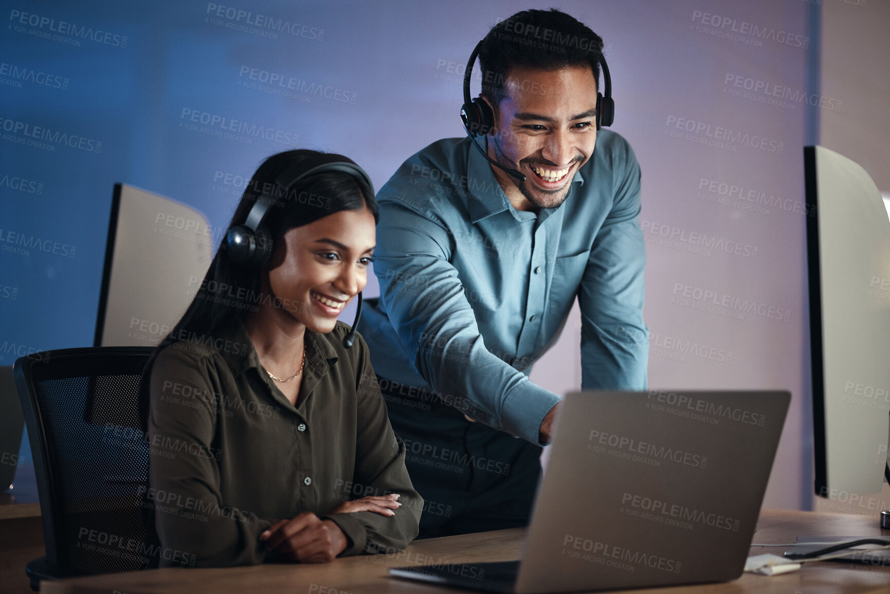 Buy stock photo Happy business people, call center and coaching at night in customer service or tech support at office. Businessman and woman working late for virtual assistant, consultant team or help at workplace