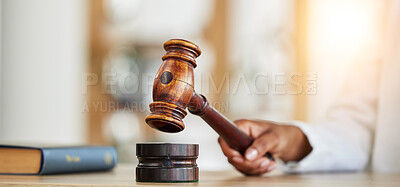 Buy stock photo Closeup, lawyer and gavel of judge in office of trial, attention and meeting for justice in courtroom, law firm or table. Hammer, legal tool and hands of person for decision, constitution or attorney