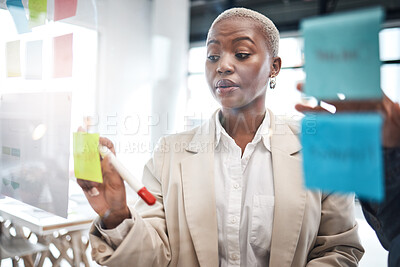 Buy stock photo Black woman, sticky note and schedule planning for brainstorming, teamwork or tasks at the office. African female person or employee working on team strategy, ideas or business agenda at workplace