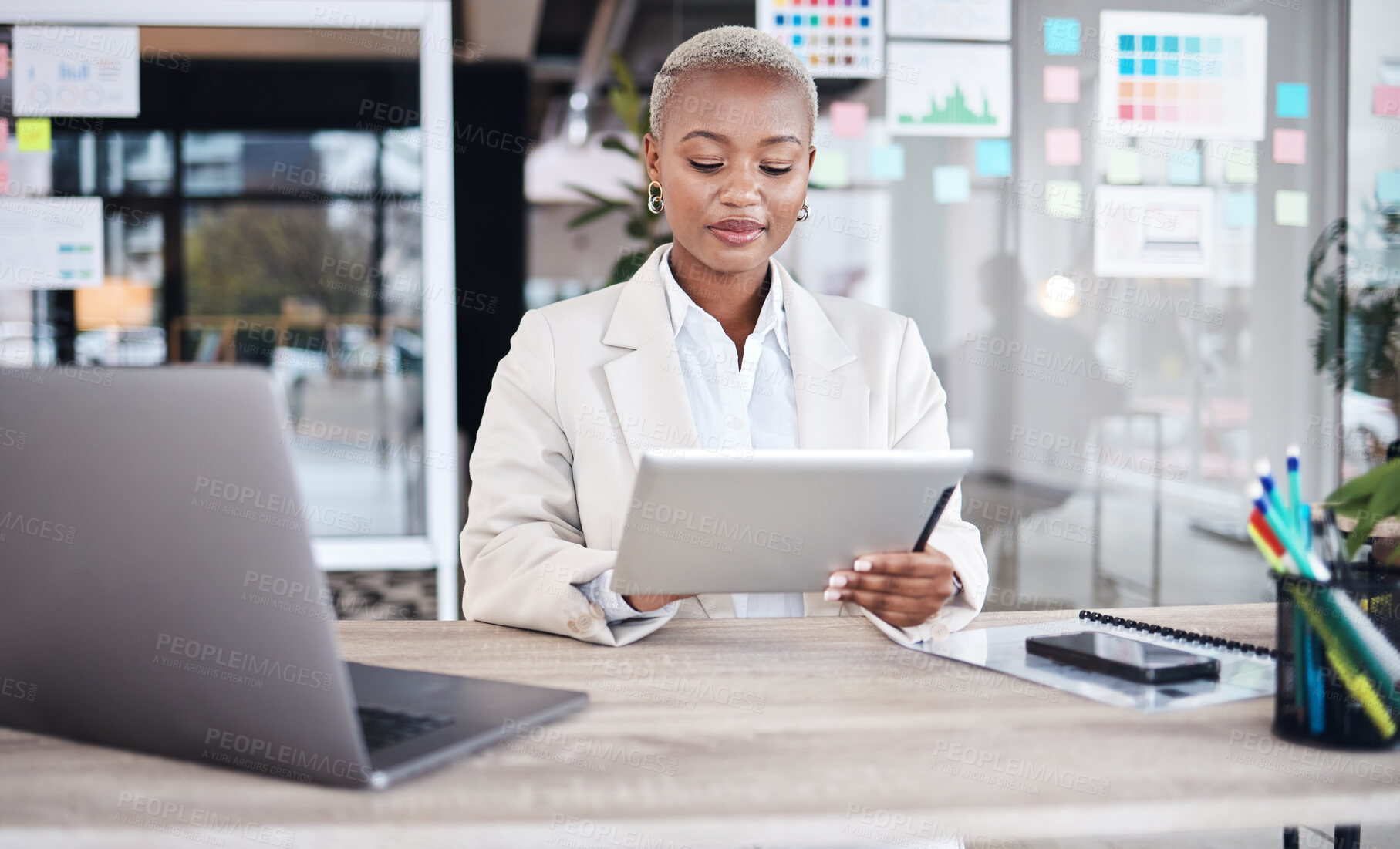 Buy stock photo Laptop, business and black woman in office on tablet for research, website and browse internet. Corporate, connection and female person on digital tech working on online project, report and review