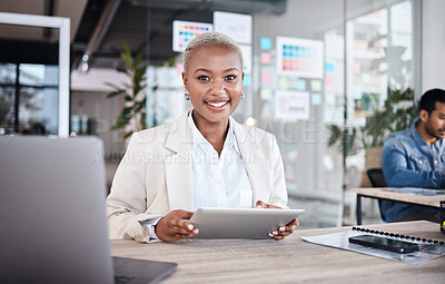 Buy stock photo Portrait of happy woman at desk in coworking space with tablet, laptop and work at design agency. Business, smile and African girl in office with online report in digital career at tech startup job.