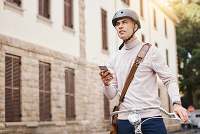 Buy stock photo Student man, bike and city with phone, thinking and search for building in street for college in summer. Young guy, retro bicycle and smartphone with transport on campus, road and outdoor with vision