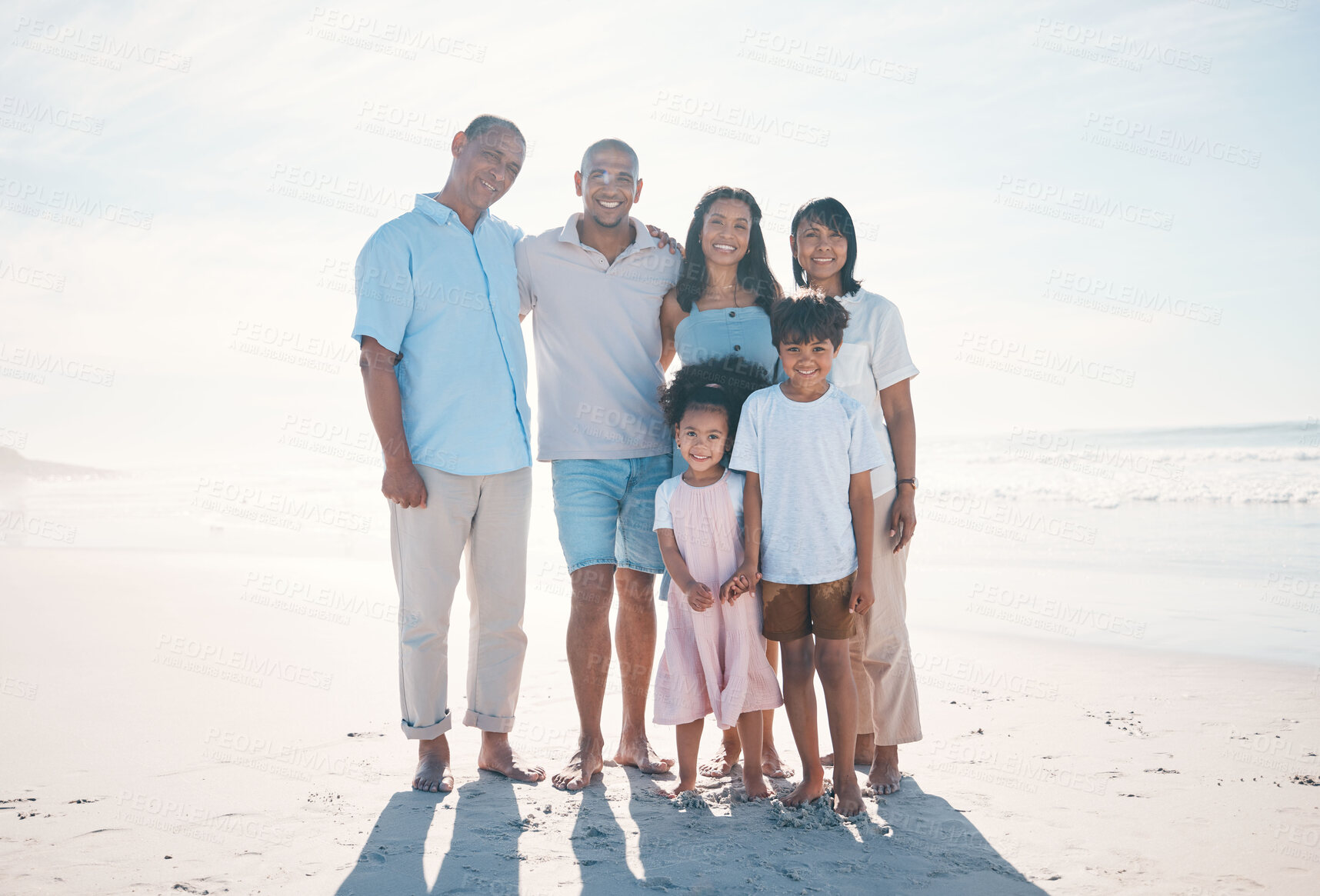 Buy stock photo Travel, beach and portrait of happy family with grandparents at the sea or ocean for love, care and happiness. Happy, sun and parents with children or kids bonding on a holiday for freedom on sand