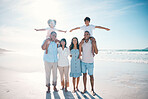 Holiday, beach and portrait of happy family bonding together at the sea or ocean for love, care and happiness. Happy, sun and parents with children or kids and grandparents on a vacation for freedom