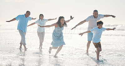 Buy stock photo Travel, beach and happy family running together at the sea or ocean bonding for love, care and happiness. Summer, sun and parents with children or kids and grandparents on a holiday for freedom