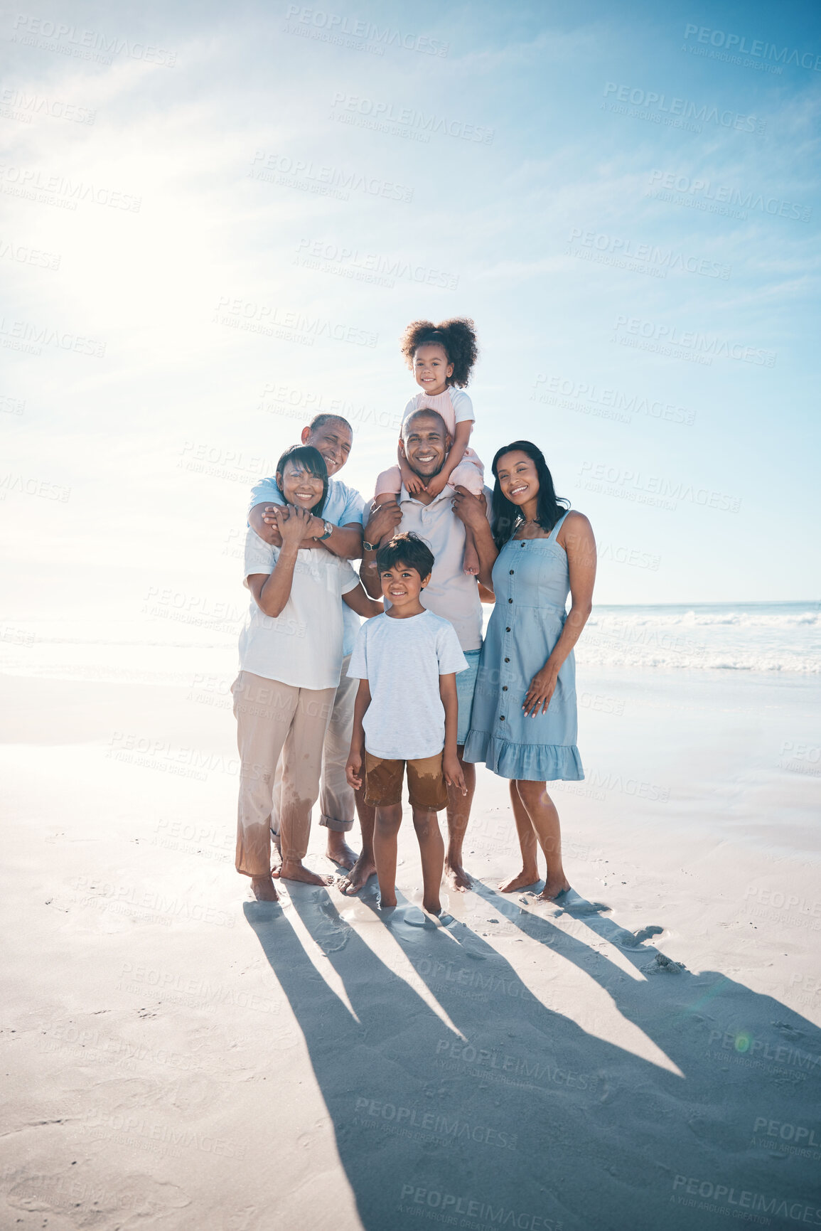 Buy stock photo Vacation, beach and portrait of happy family together at the sea or ocean bonding for love, care and happiness. Happy, sun and parents with children or kids and grandparents on a holiday for freedom