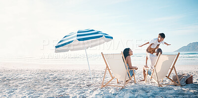 Buy stock photo Beach, travel and family relaxing while on a vacation, adventure or weekend trip for summer. Freedom, bonding and father flying his boy child sitting by the ocean with his wife on a tropical holiday.