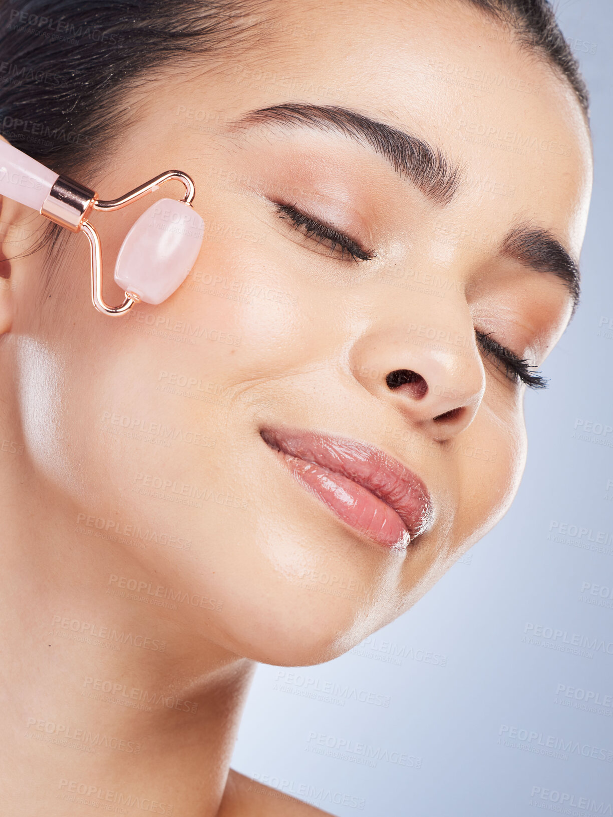 Buy stock photo Happy woman, beauty or rose quartz roller for face massage, healthy skincare on studio background. Glow, grooming treatment or model smiling with dermatology facial cosmetics or product to relax 