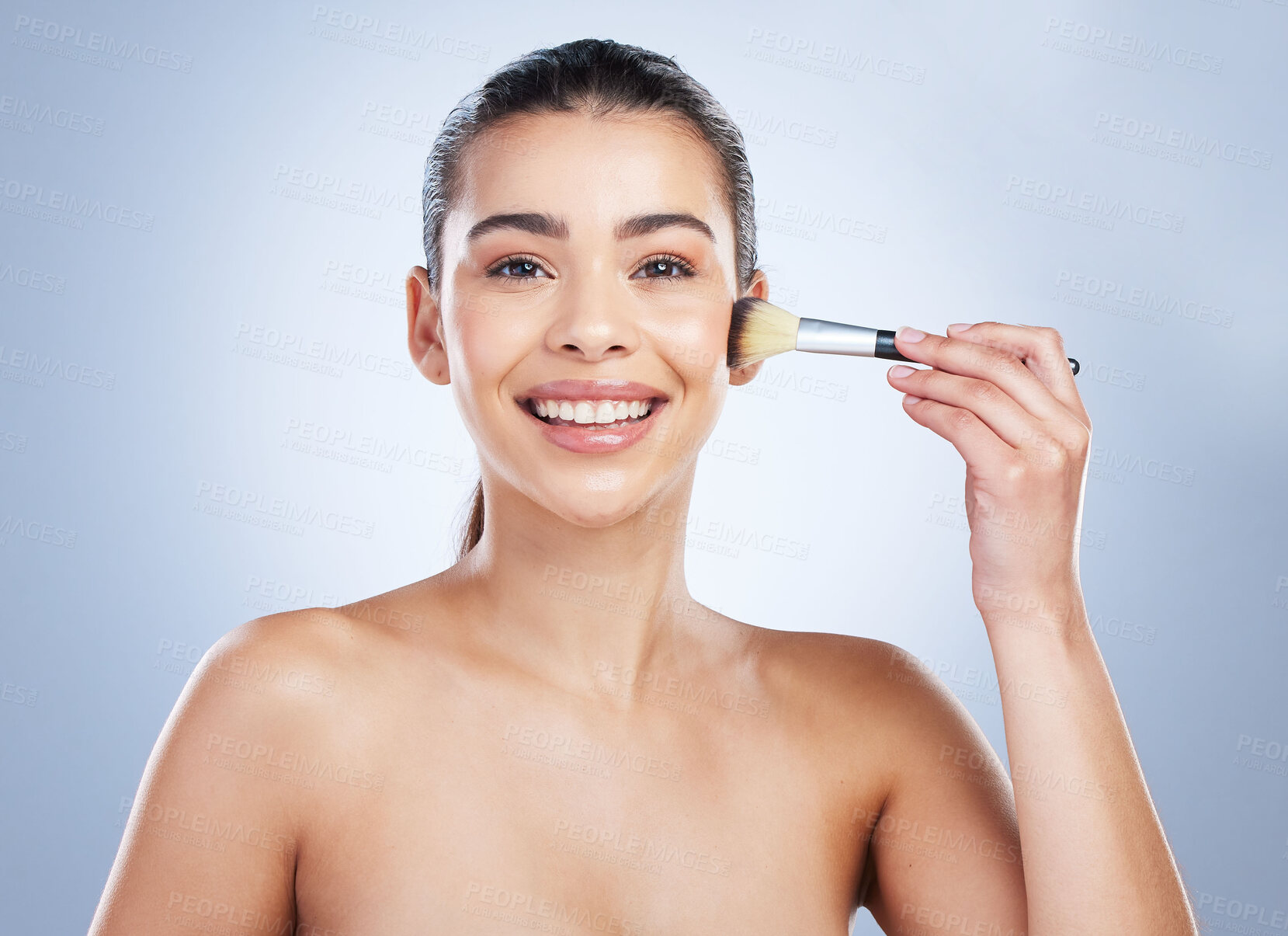 Buy stock photo Makeup, portrait and happy woman with brush in studio for cheeks, cosmetics and application on grey background. Face, smile and female wellness model with tool for beauty, glamour or contour results