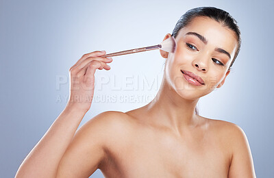 Buy stock photo Beauty, cosmetic and woman with a makeup brush in a studio for natural, glamour and face routine. Glow, self care and young female model with a cosmetology facial tool isolated by a gray background.