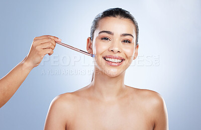 Buy stock photo Beauty, cosmetic and portrait of woman with a makeup brush in studio for natural glamour facial routine. Self care, glow and young female model with cosmetology face tool isolated by gray background.