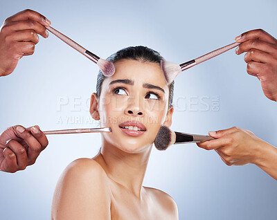 Buy stock photo Brush, makeup and confused face of woman in studio for wellness, beauty and cosmetics on blue background. Cosmetology, skincare and girl with brushes for cosmetic application, foundation and products