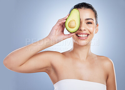 Buy stock photo Avocado, skincare and portrait of latino woman in studio happy with detox, wellness or omega 3 treatment on grey background. Fruit, face and lady model smile for anti aging or vitamin c facial beauty