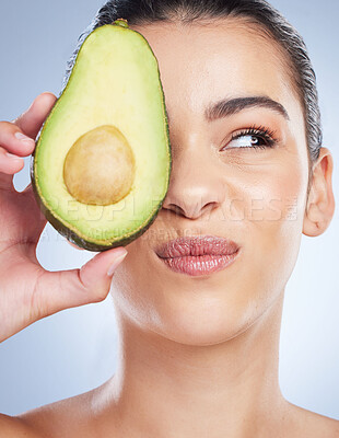 Buy stock photo Avocado, skincare and face of woman in studio with doubt of natural detox, wellness or omega 3 treatment on white background. Fruit, diet or lady model unsure of anti aging or vitamin c facial beauty