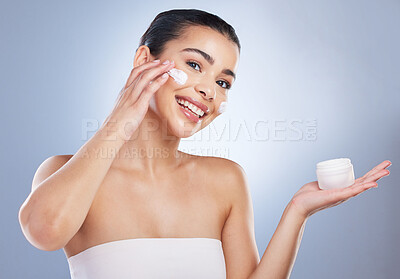 Buy stock photo Skincare, face cream and portrait of woman in studio for natural, health or wellness face routine. Beauty, self care and female model with facial spf, lotion or sunscreen isolated by gray background.