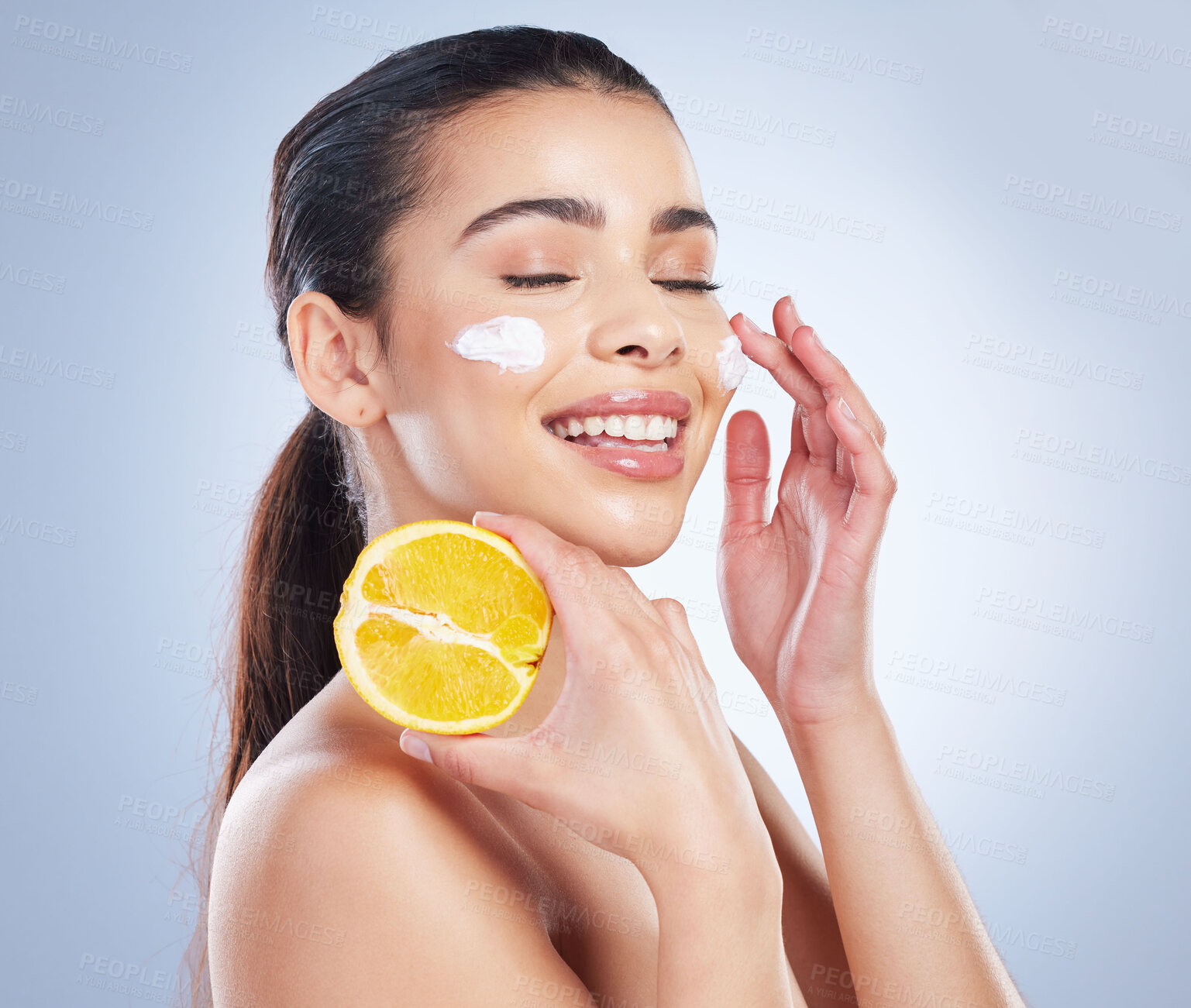 Buy stock photo Lemon, skincare and asian woman with face cream in studio for wellness or cosmetic mask on grey background. Citrus, fruit and lady with facial for dark spots, melasma or acne prevention or sunscreen