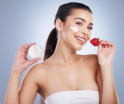 Buy stock photo Beauty, face cream and portrait of woman with strawberry in studio for natural, health or wellness routine. Skincare, self care and female model with fruit for facial treatment by a gray background.