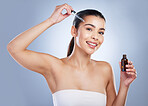 Beauty, face serum and skin portrait of a woman in studio with a skincare product for natural glow. Happy female aesthetic model on a gradient background for facial shine, cosmetics and self care oil