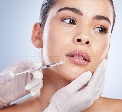 Syringe, woman and plastic surgery with skincare, collagen and beauty against a studio background. Female person, girl or model with a needle, cosmetics or body transformation with aesthetic and care