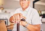 Hands, serious and portrait of a man with a cane for medical help, senior support and health. Sad, house and an elderly person with a disability in the living room with a walking stick closeup