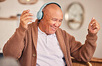 Music, headphones or happy old man listening to radio playlist to relax in house to enjoy retirement. Home, freedom or senior person dancing, smiling or streaming sound, song or audio on break alone