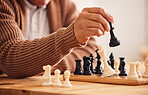 Man, chess and hand for moving, game or competition with focus, strategy or problem solving at desk. Person, master and brain power for board contest, mindset or checkmate for winning, table or house