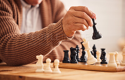 Buy stock photo Man, chess and hand for moving, game or competition with focus, strategy or problem solving at desk. Person, master and brain power for board contest, mindset or checkmate for winning, table or house
