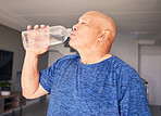 Home, fitness or senior man drinking water for wellness, hydration or exercise recovery in retirement. Training, fatigue or thirsty mature person drinks healthy h2o liquid on a workout break to relax
