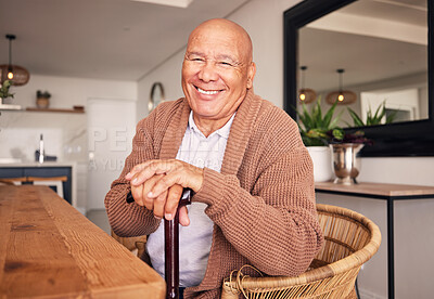 Buy stock photo Portrait, walking stick and a senior man with a disability sitting in the living room of his home during retirement. Smile, cane and relax with an elderly person at the dining room table in his house