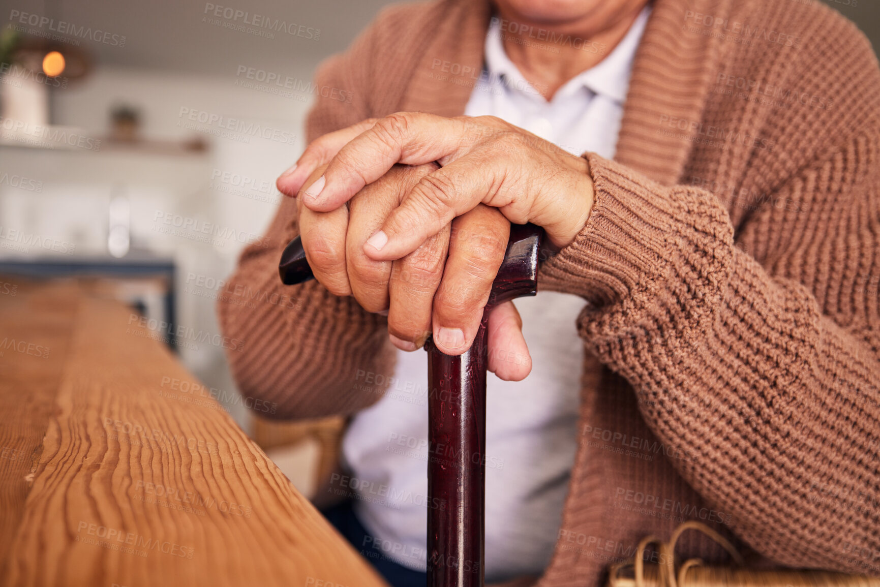 Buy stock photo Closeup, hands and cane of person with disability, arthritis and aid of osteoporosis, parkinson or stroke. Retirement, senior patient and holding walking stick of support, help or healthcare mobility