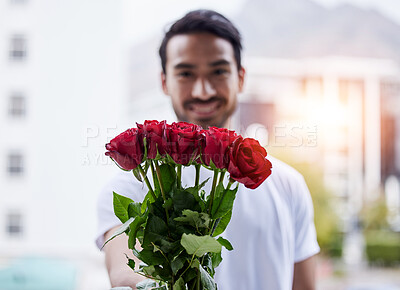 Buy stock photo Love, gift and portrait of happy man with roses for date, romance and valentines day. Smile, romantic hope and person giving bouquet of flowers in city, proposal or engagement on blurred background.