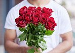 Love, romance and man with bouquet of roses for date, hope for valentines day and cropped. Romantic confession, floral gift and person giving red flowers, standing outside for proposal or engagement.