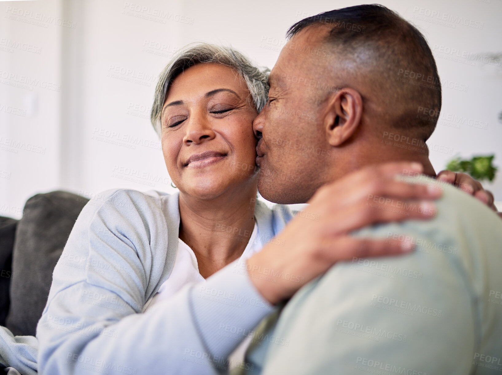 Buy stock photo Love kiss, home and face of elderly couple, affection and enjoy quality time together, support or retirement. Romantic bond, marriage care or senior husband, wife or people relax for weekend wellness