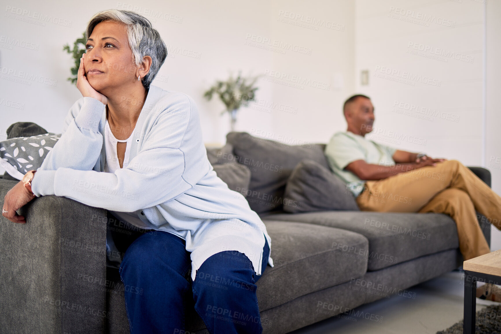 Buy stock photo Woman, couple and divorce problem on sofa for drama, frustrated people and conflict at home. Sad lady thinking of argument, bad marriage and fight of breakup, crisis or ignore angry partner in lounge