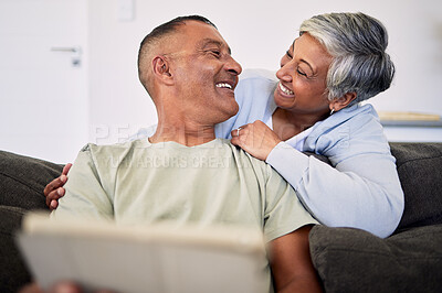 Buy stock photo Love, tablet and happy senior couple bonding, relax and check email, news article and enjoy retirement eye contact. Website story, online shopping and elderly man, old woman or people smile at home