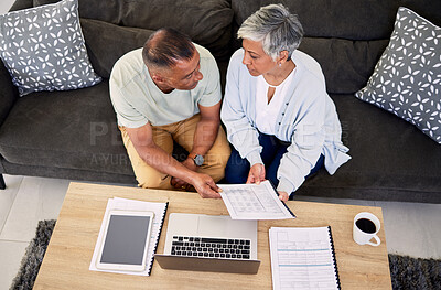 Buy stock photo Senior couple, tax documents and laptop in home living room for discussion, planning and finance. Elderly man, old woman and paperwork for financial compliance in top view, lounge sofa and retirement