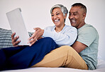 Bed, tablet and happy elderly couple laughing at funny social network blog, email or watch comedy video, podcast or meme. Funny morning article, home bedroom and senior people laugh, bond and hug