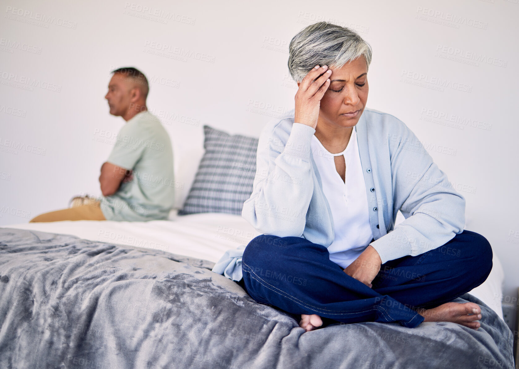 Buy stock photo Angry, divorce and a senior couple in the bedroom for a fight, sad and depression in marriage. Stress, mental health and an elderly woman with anxiety about a problem with a man on a bed for conflict