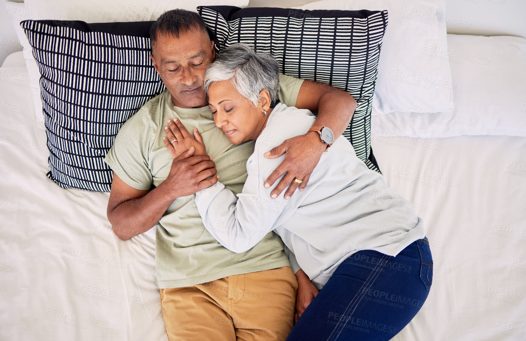 Buy stock photo Top view, bed and senior couple hug, sleeping and marriage with peace, relationship and retirement. Romance, old man and elderly woman in a bedroom, asleep and embrace with happiness, home and care