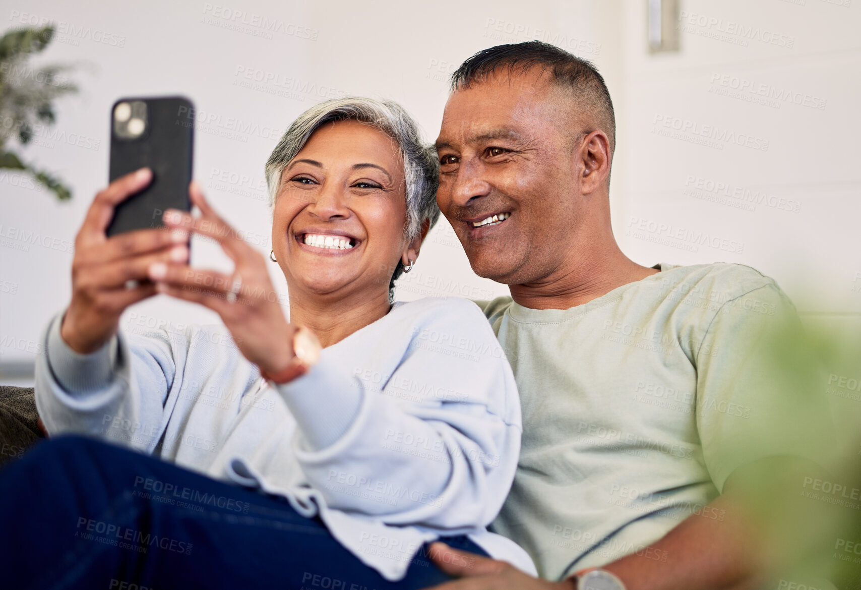 Buy stock photo Love, selfie and happy senior couple bonding, relax and post memory picture, smile and enjoy retirement free time. Social media upload, home and elderly man, old woman or people pose for photo